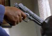 Total chaos as armed gang threatens to shoot popular prophet during church service