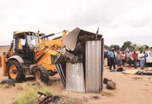 Fracas as council officers throw man out of moving truck in tuckshop demolition fallout