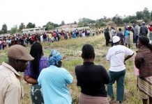 Woman hears people screaming outside her yard, rushes there & sees her husband lying in pool of blood