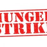 hunger-strike-red-rubber-stamp-over-white-background
