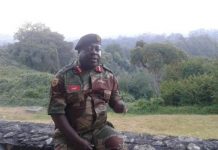 Caught unaware: Army General Rugeje (rtd) watches in horror as heavily armed CIOs storm bar hunting for anti ED activist