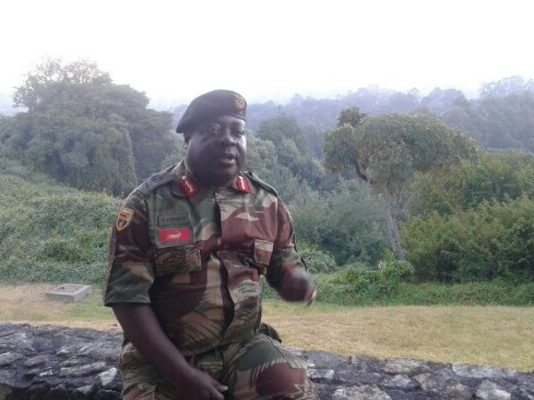 Caught unaware: Army General Rugeje (rtd) watches in horror as heavily armed CIOs storm bar hunting for anti ED activist