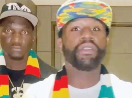 Floyd Mayweather splashes the cash in Zimbabwe! Boxing bad boy blows dollar bills on dance troupe