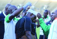 Referee left bleeding and battered as soccer thugs vent their anger on him after controversial game