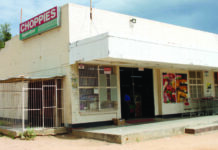 Heavily armed robbers open gunfire at supermarket, stab security guard FOUR TIMES and flee with cash