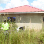 Zvipoko play soccer on roof top of a Seke house that was built on old graves, dead people’s voices demand respect and attention