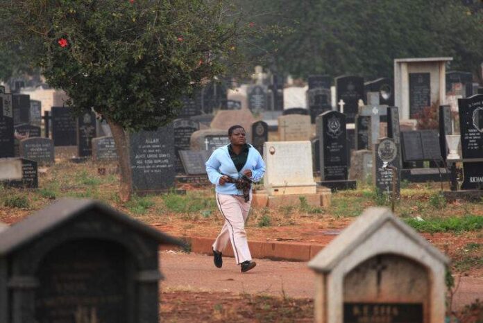 woman running in cemetery