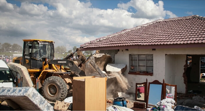 house demolition land barons illegal structures demolished