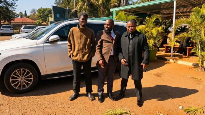 Adventist Evangelist Sam Marufu (centre) and his lawyer Admire Rubaya (right)
